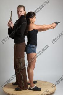 2021 01 OXANA AND XENIA STANDING POSE WITH GUNS 4…